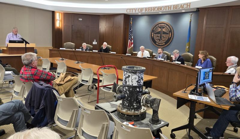 Rehoboth Beach Public Works Director Henry Matlosz makes a presentation to Rehoboth Beach commissioners during a meeting Dec. 20. Sitting in the front of the room is a diffuser that’s found at the outfall in Rehoboth. This one was damaged by an anchor.